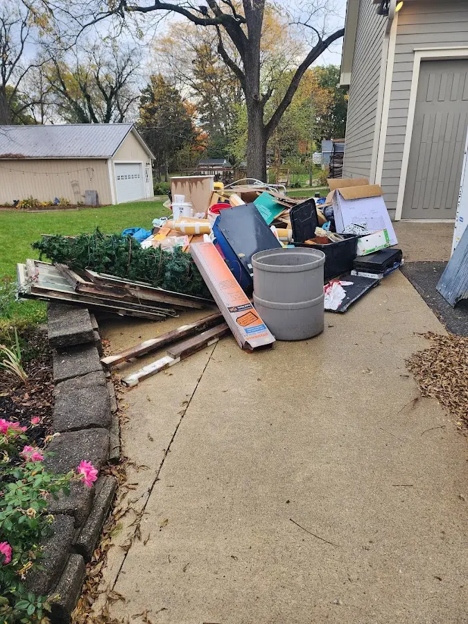 Dumpster being loaded with debris for Roofing Dumpster Rental in Albemarle